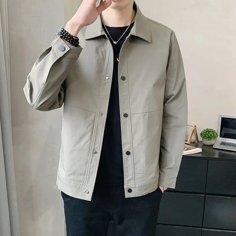 Men's Korean style thin single layer jacket in grey tones, with long sleeves, shown on a hanger.