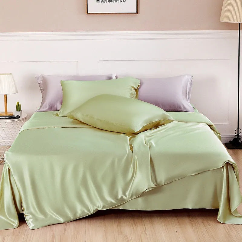 Silk double-sided duvet cover showing reversible design in solid colours including lotus pink, pea green, and bright brown