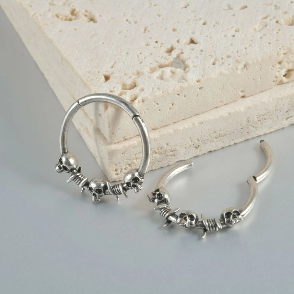 Copper punk-style earrings featuring a ghost head motif in antique silver or gold finish.
