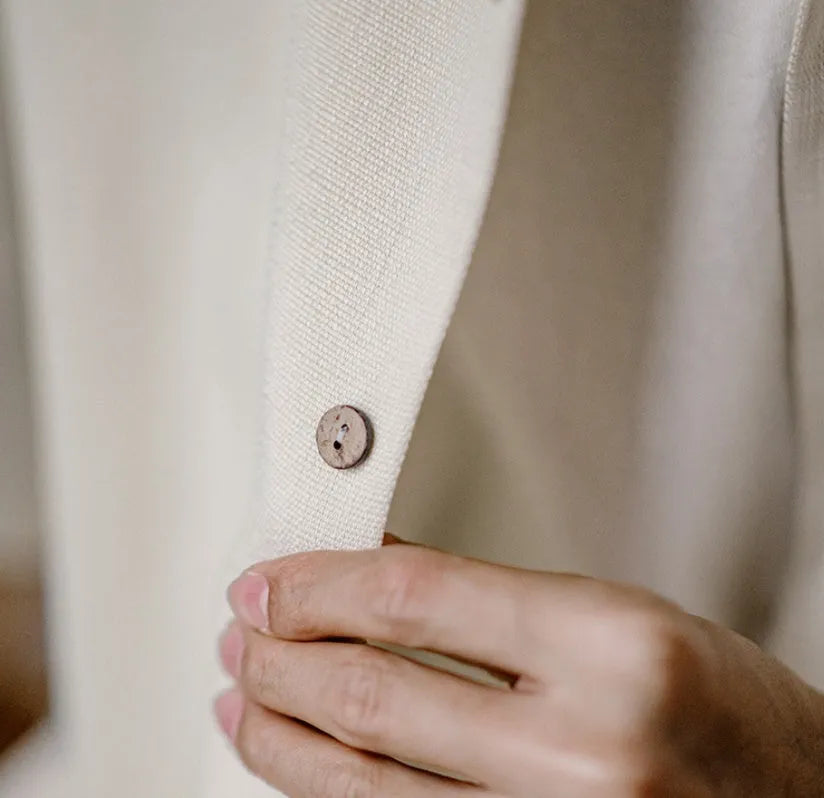 Light apricot men's shirt with bamboo print and a Cuban collar laid flat.