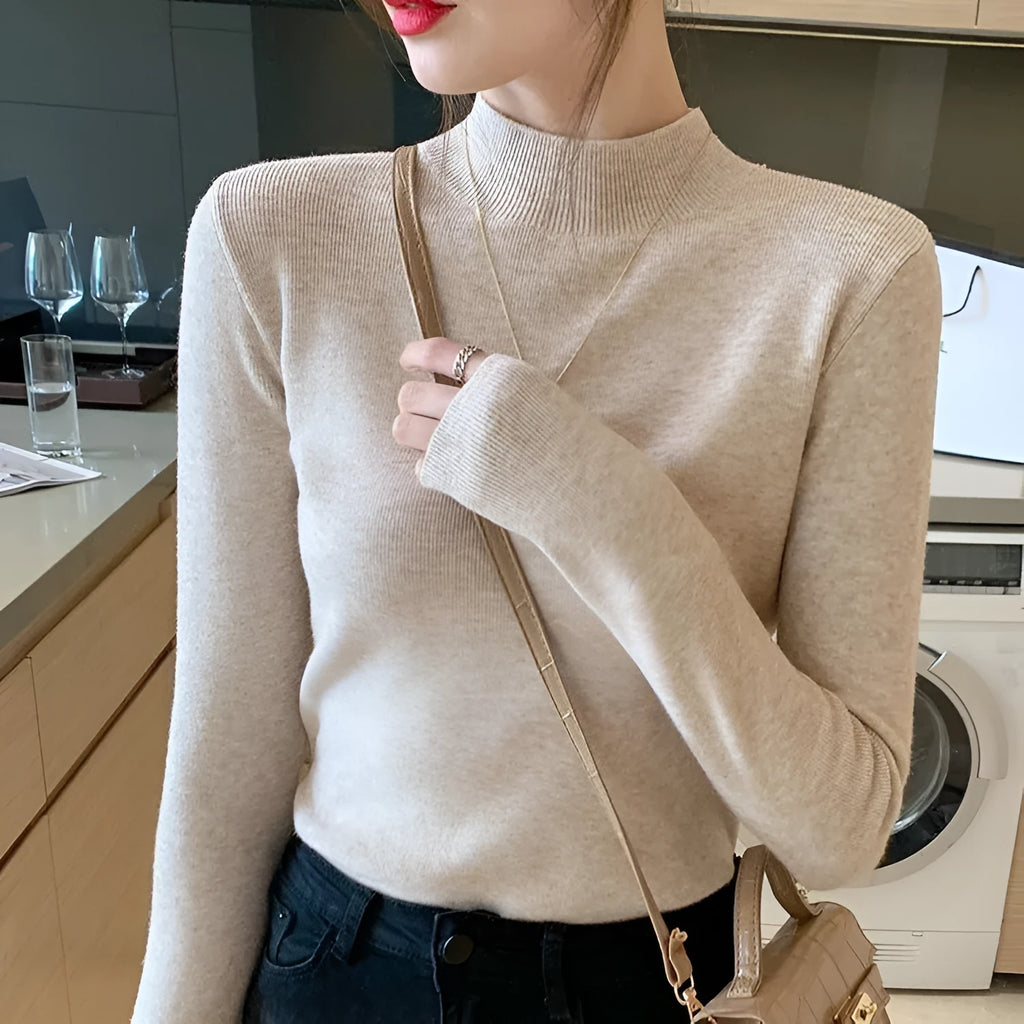 Slim fit viscose knitted top in mild blue colour with long sleeves on hanger