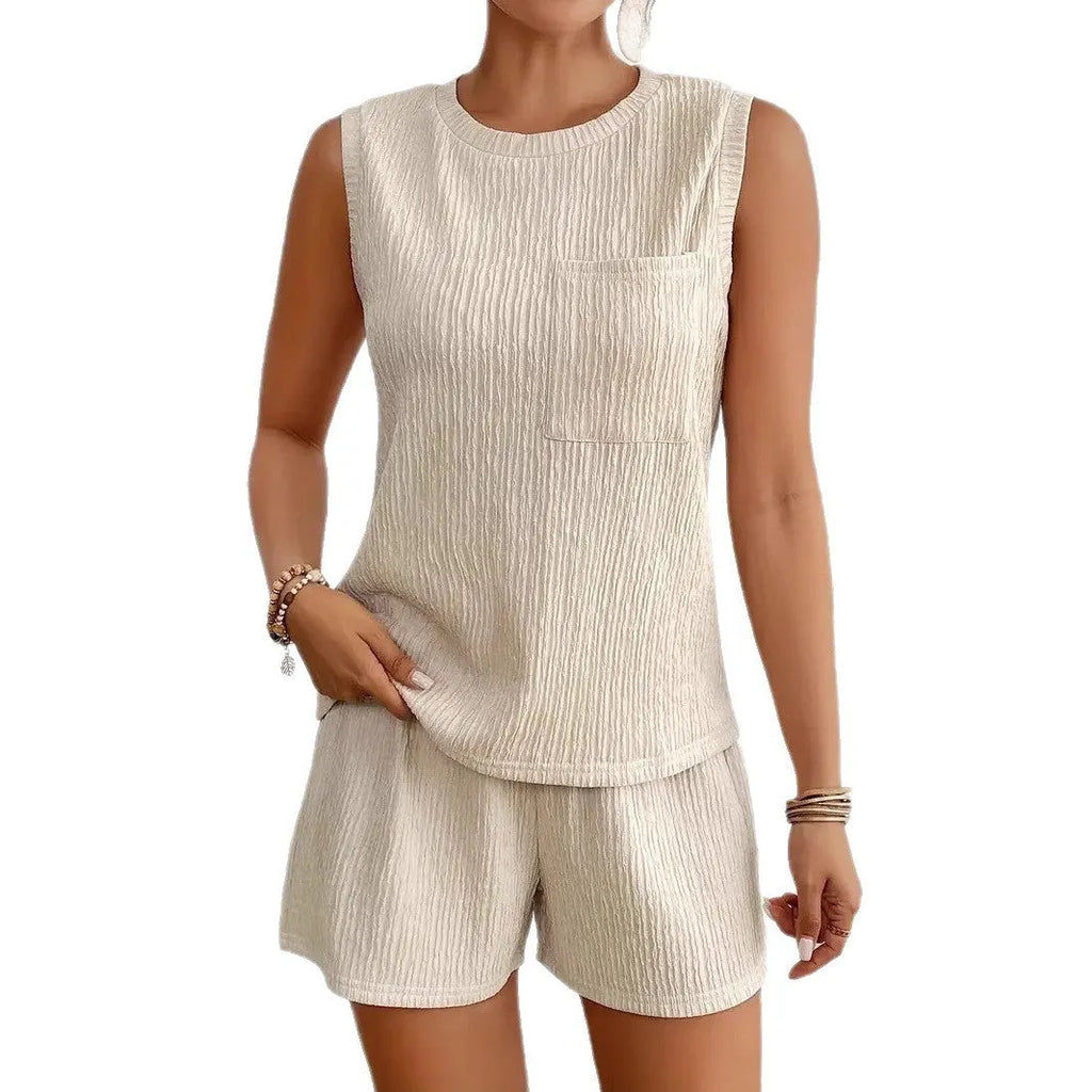 Women's apricot sleeveless round neck vest and matching shorts laid flat.