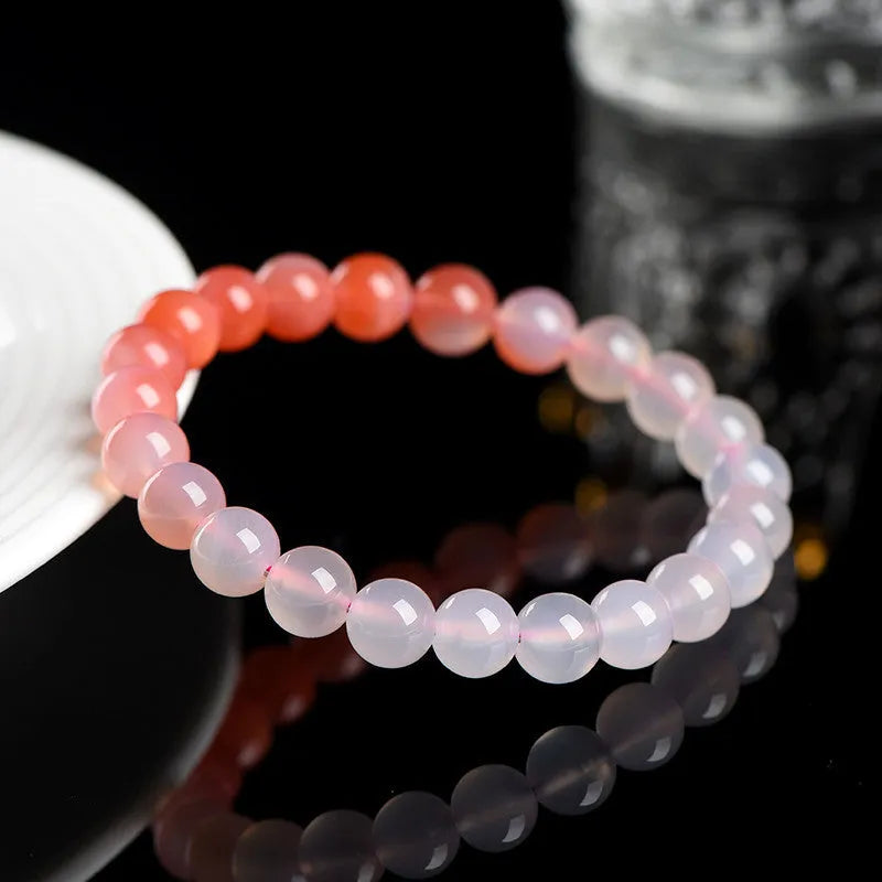 Natural gradient Yanyuan agate bracelet in geometric single-circle design on a neutral background.
