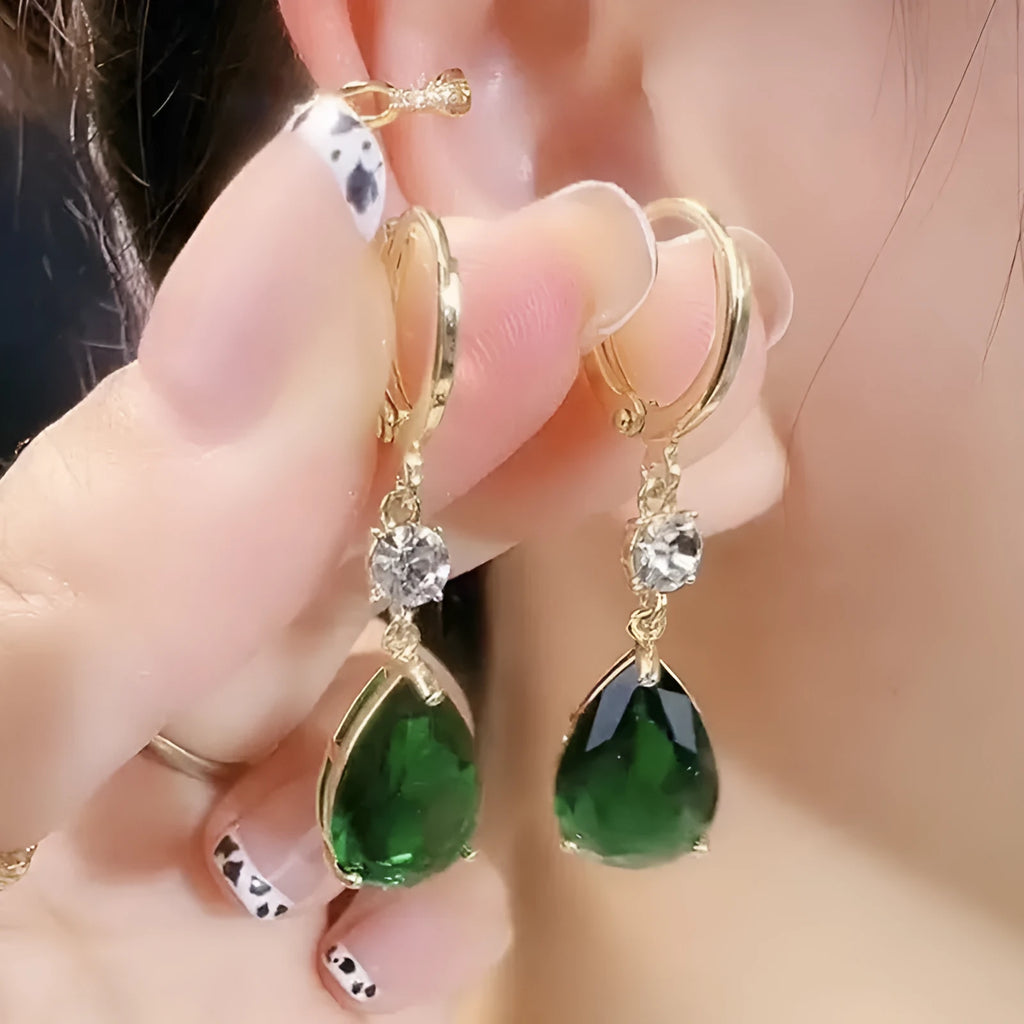 A pair of green geometric teardrop earrings made from alloy metal.