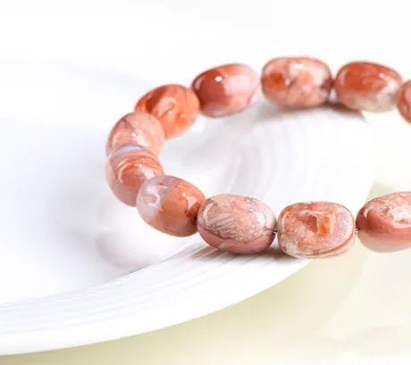 Natural cherry agate bracelet with 10x14mm barrel beads and Ruyi decorative elements