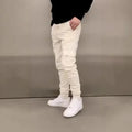 Men's loose-fit polyester trousers with elastic waist and dimensional patch pockets in light blue colour
