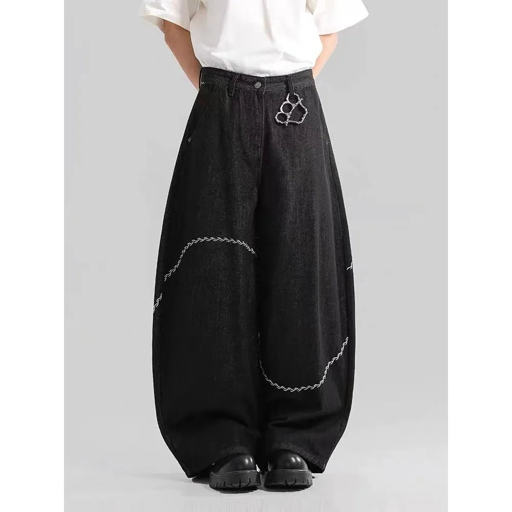Black Pu Shuai straight-leg denim trousers with a mid waist and zip fly, laid flat.