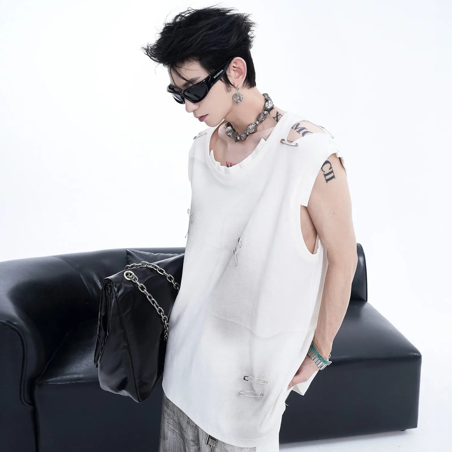 Men's black ripped vest waistcoat with irregular cutting, sleeveless design, round neck.