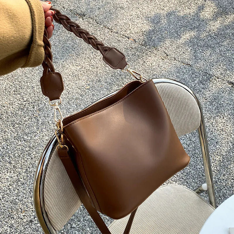 Retro brown PU leather crossbody bucket bag with a woven texture design.