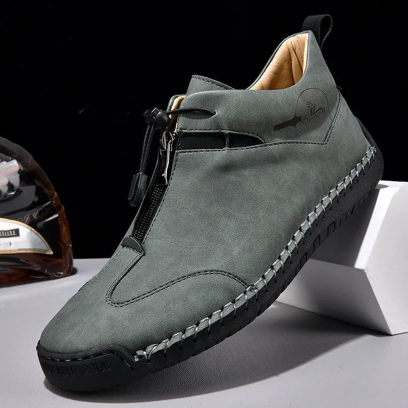 Men's black casual leather shoes with a round toe and mid-height rubber sole.