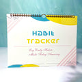 English habit tracking book open showing pages, 21cm by 28cm in flower white colour