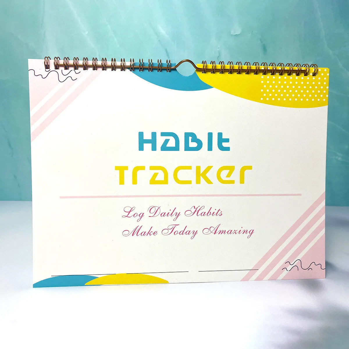 English habit tracking book open showing pages, 21cm by 28cm in flower white colour