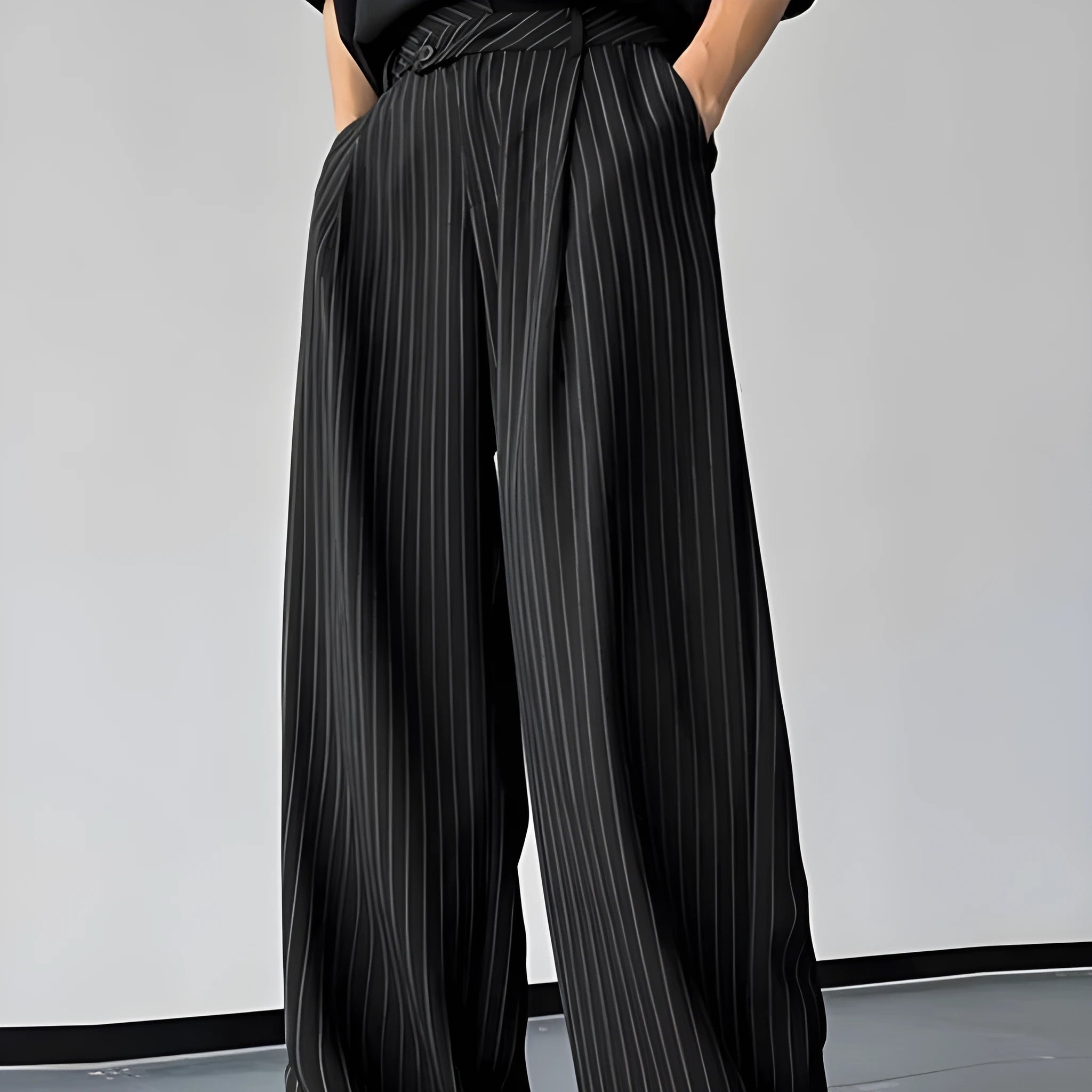 Black men's trousers with vertical stripes and pleated design detail