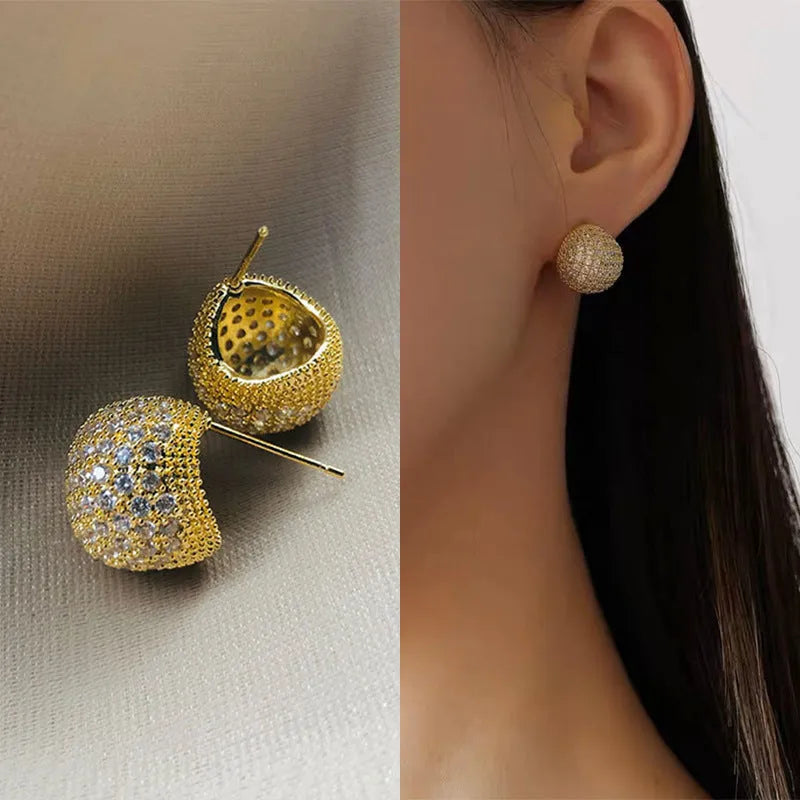 Gold and white geometric drop earrings with sphere elements and crystal embellishments