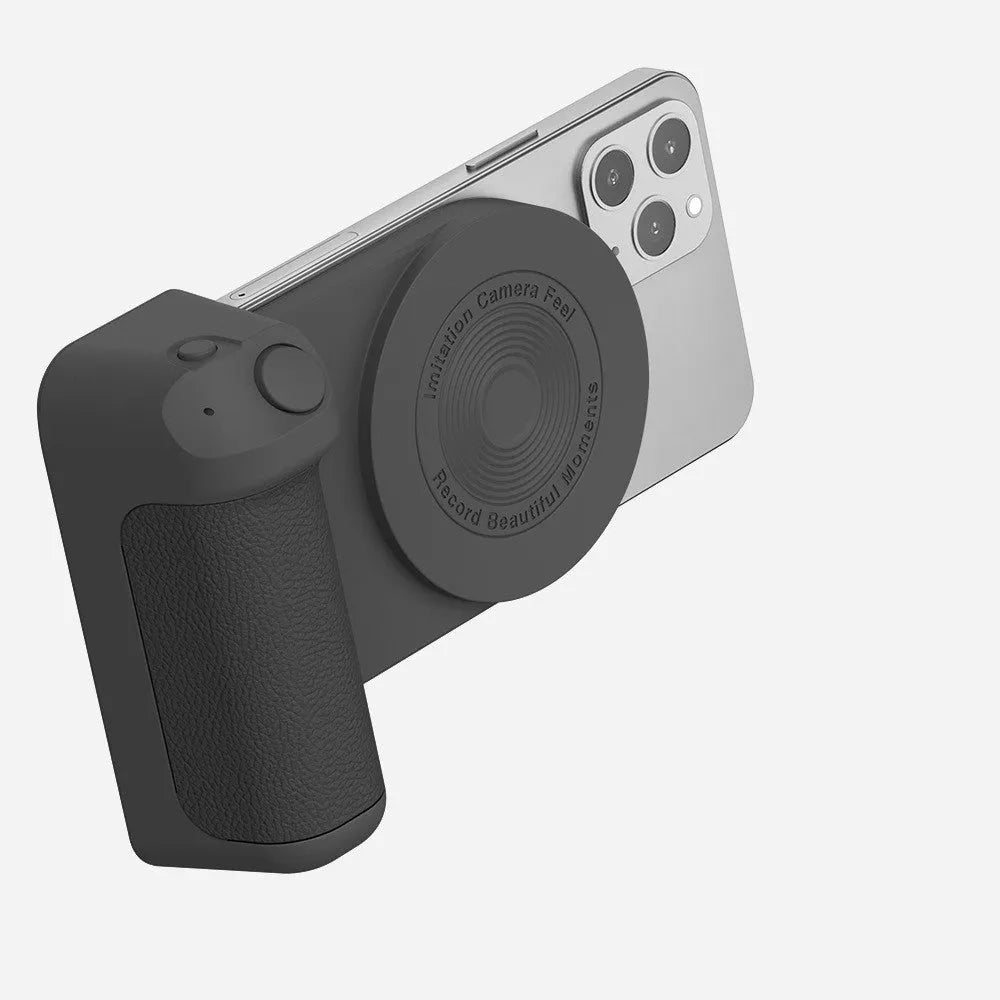 Black 3-in-1 magnetic phone camera holder with ergonomic handle on a wooden table.