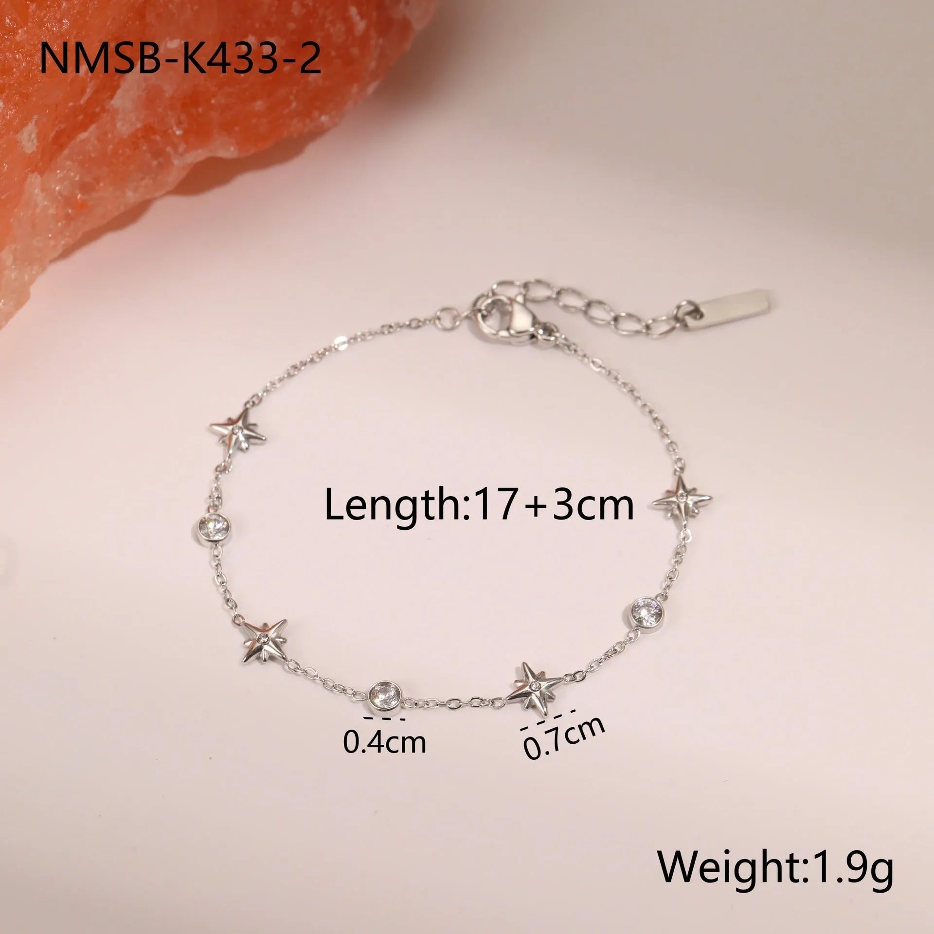 Gold-plated titanium steel women's bracelet with a geometric hexagonal star zircon pendant.
