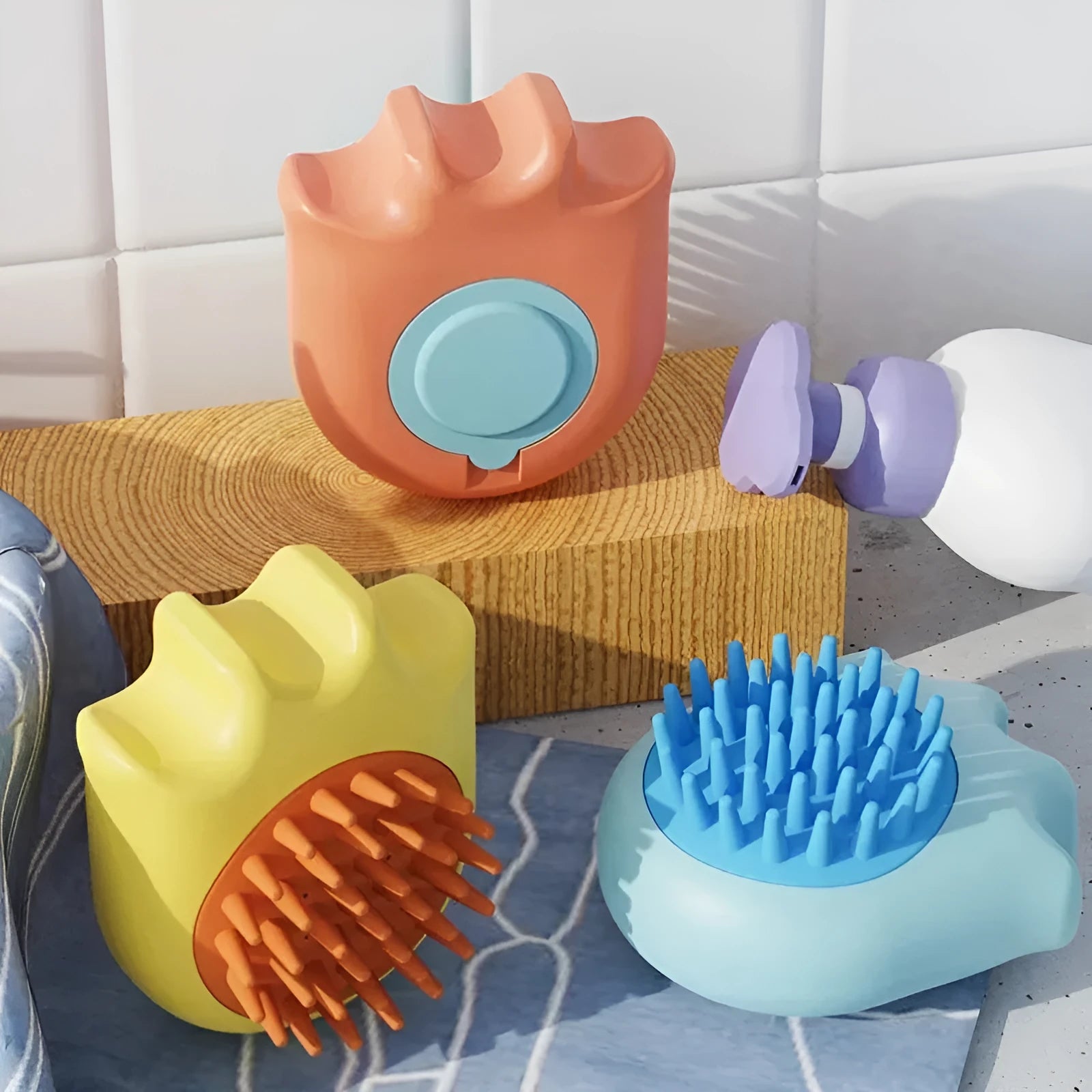 Blue pet bath brush with shampoo box for cat and dog washing, showing massage bristles and comb teeth