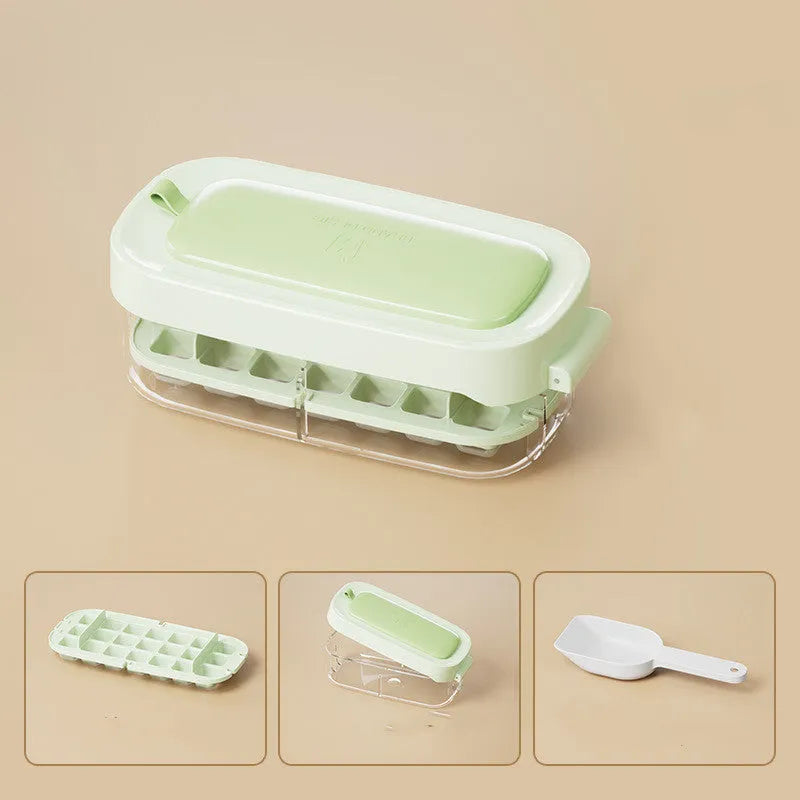 High capacity plastic ice cube tray with grid and removable ice shovel stored in its slot.