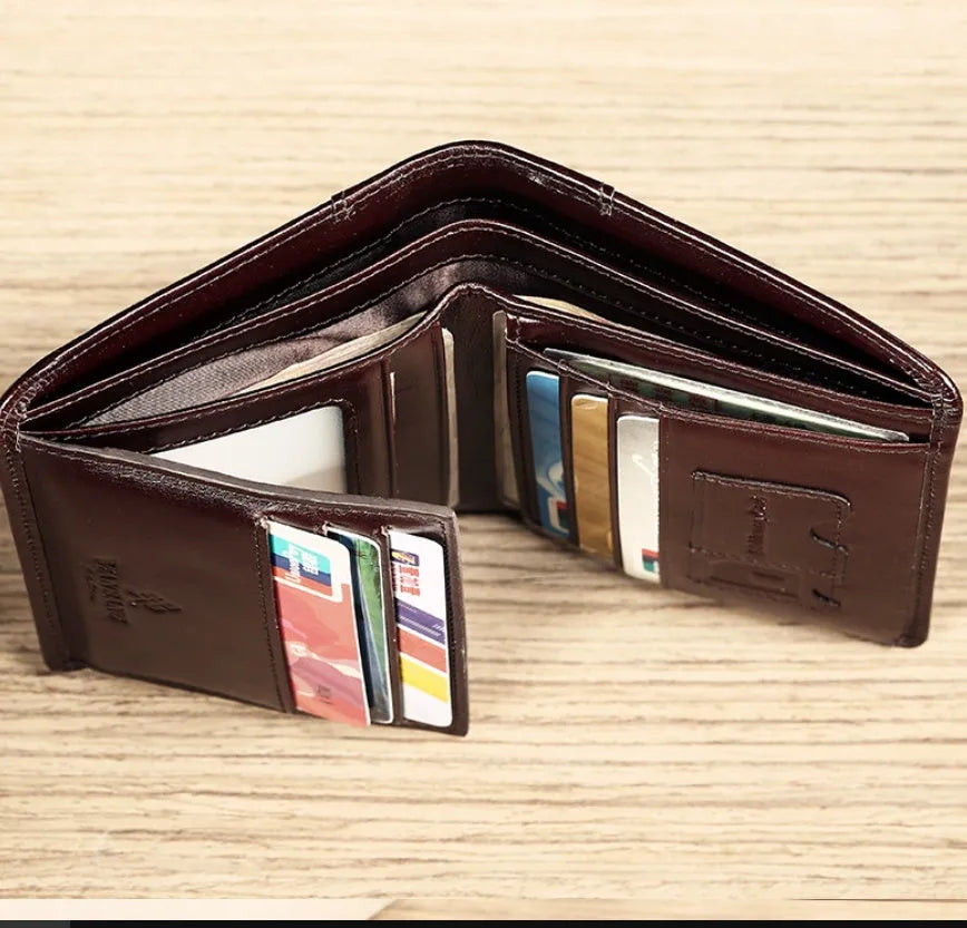 Men's leather wallet showing multiple internal compartments including card slots and change purse