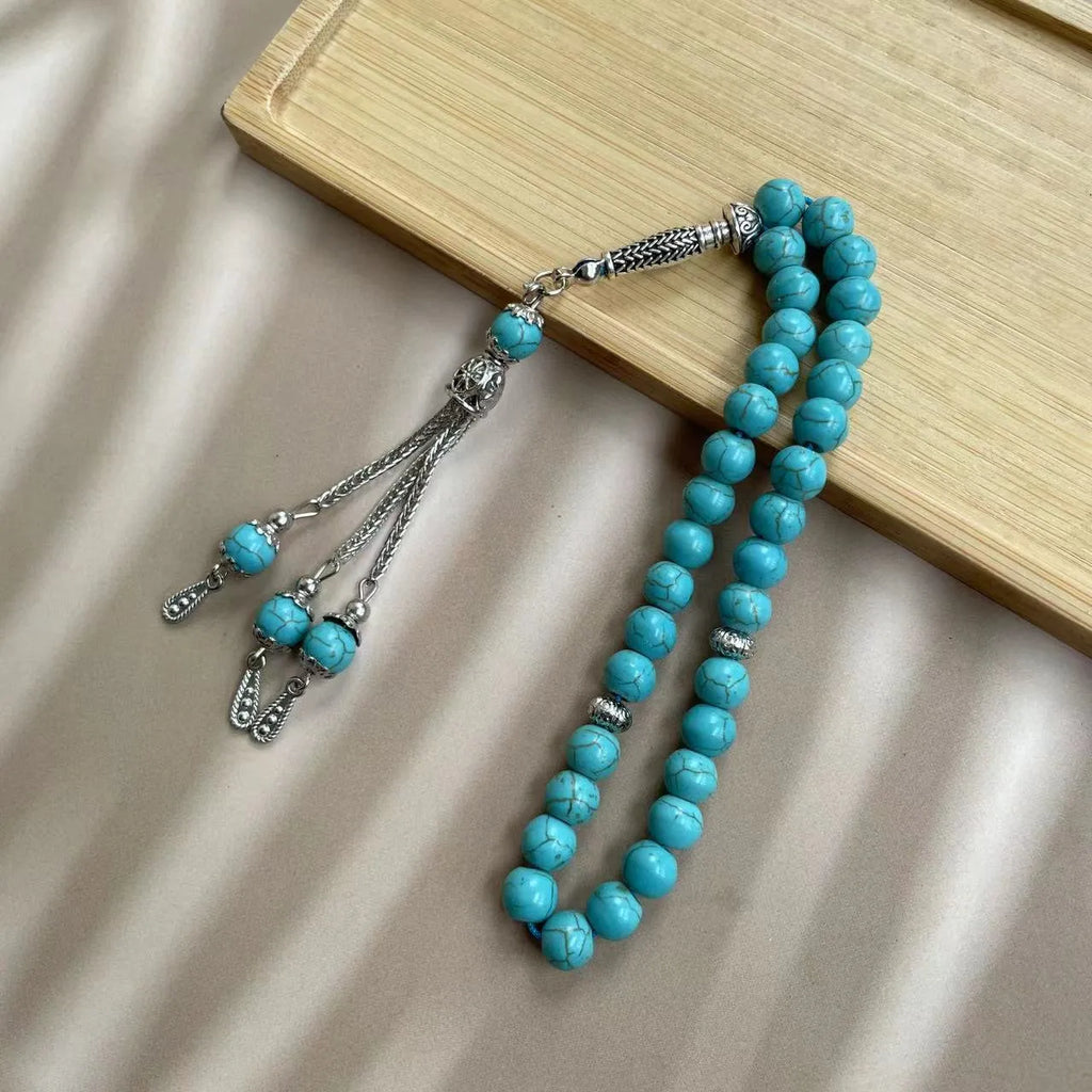 Handmade sky blue stone Muslim prayer bracelet with 8mm beads on wrist.