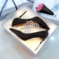 Women's silver crystal wedding shoe with a mid-height heel on a white background.