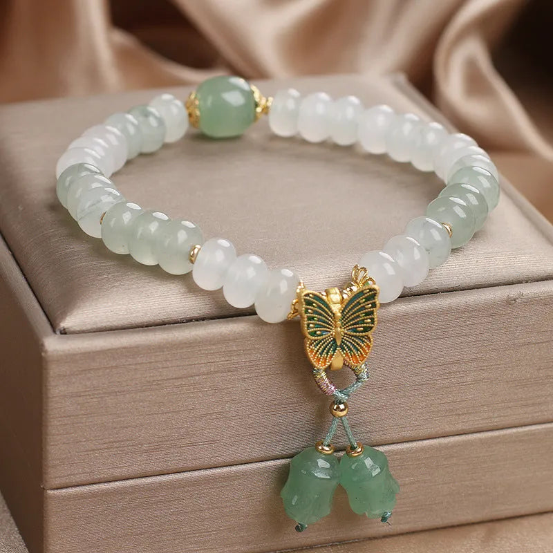 Tian Shan Cui green crystal abacus beads bracelet with butterfly tassel and pearl rhinestone sequin details, 17cm
