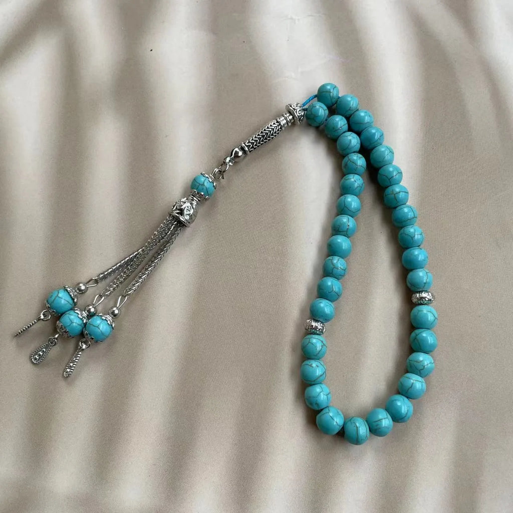 Handmade sky blue stone Muslim prayer bracelet with 8mm beads on wrist.