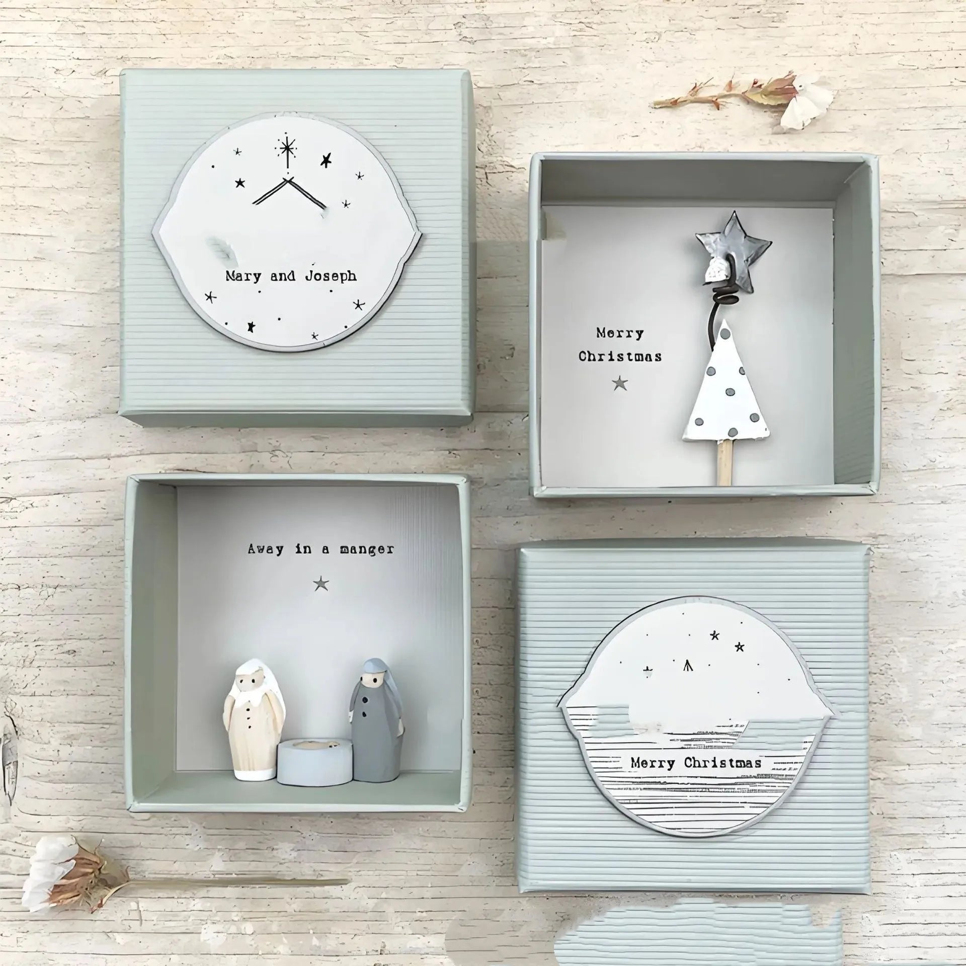 Boxed guardian angel ornament in modern cartoon style with resin and plastic construction