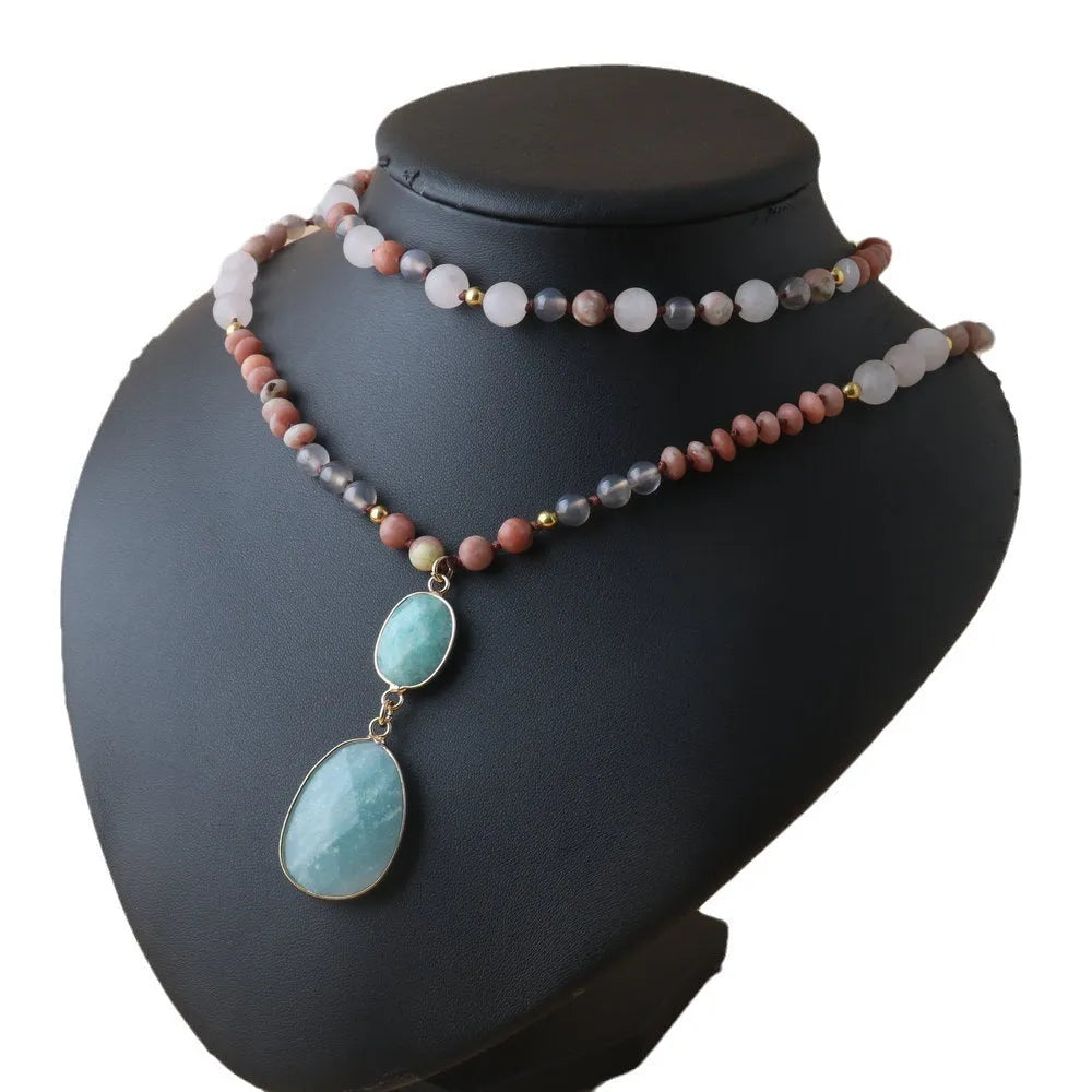Unisex natural stone beaded necklace with round beads in pink and green colour options on white background