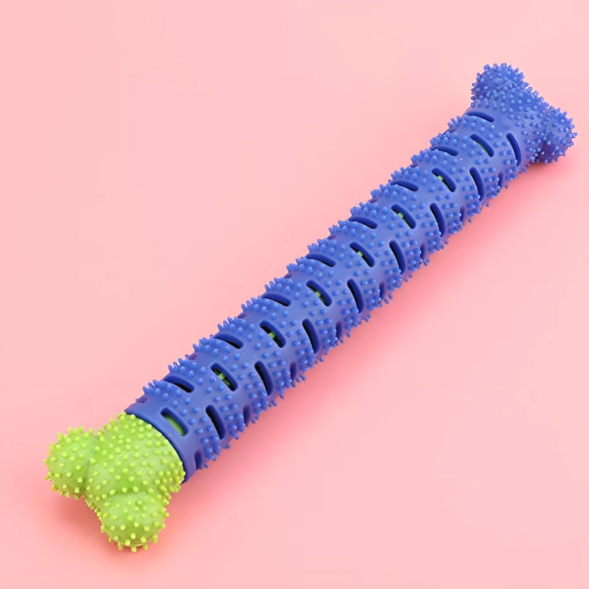 Blue-green dog molar tooth cleaner with serrated brush head design and silicone massage nodules