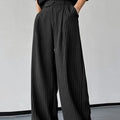 Black men's trousers with vertical stripes and pleated design detail