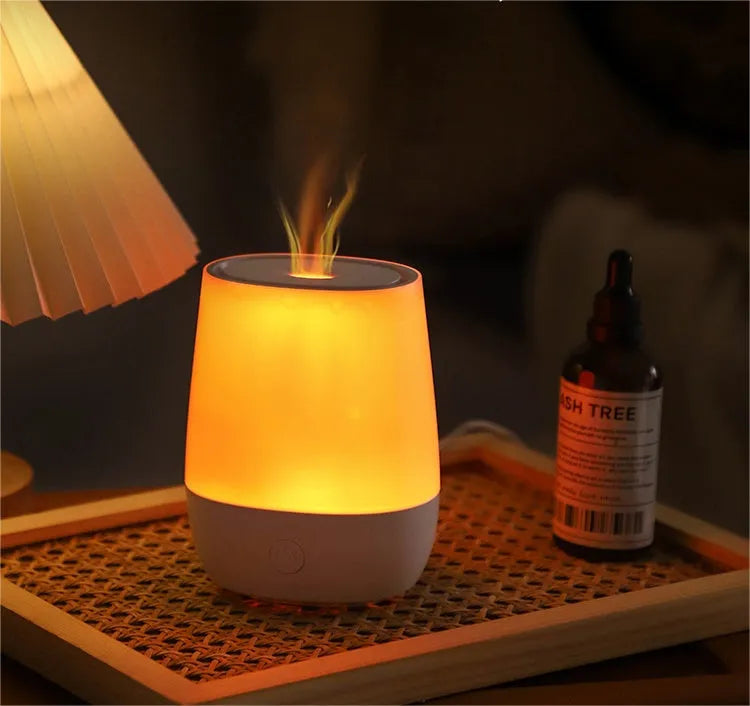 White USB aromatherapy diffuser with simulated flame effect showing mist emission