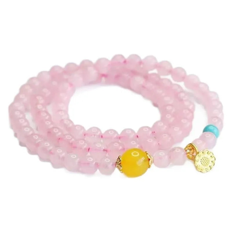 Pink artificial crystal multi-circle bracelet featuring classic Pi Xiu design on white background