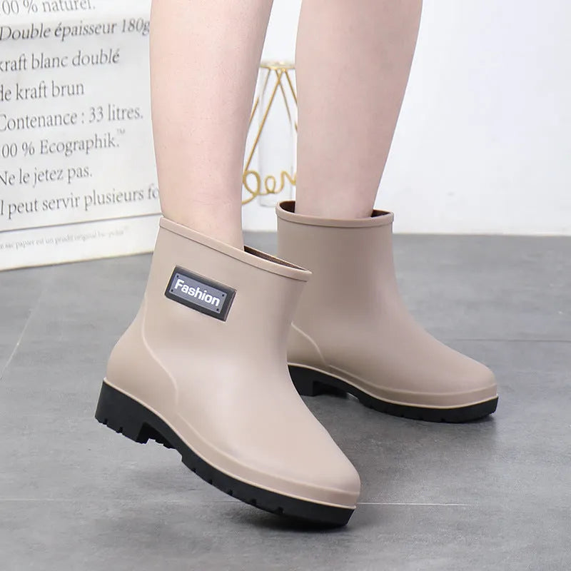 Women's PVC mid-calf rain boots in black with low heel, size 36-40