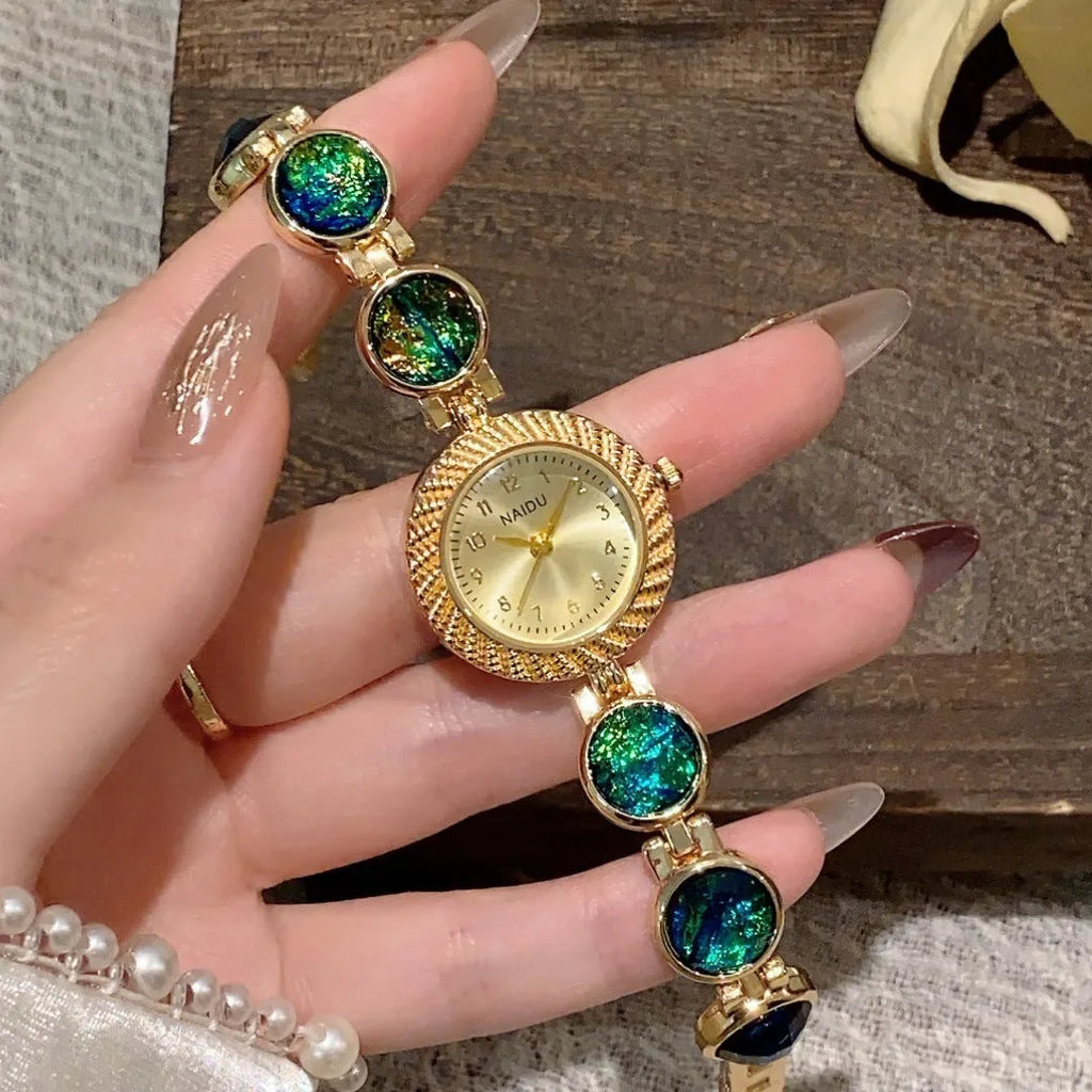 Women's 25mm round quartz watch in zinc alloy case, shown in various colours.