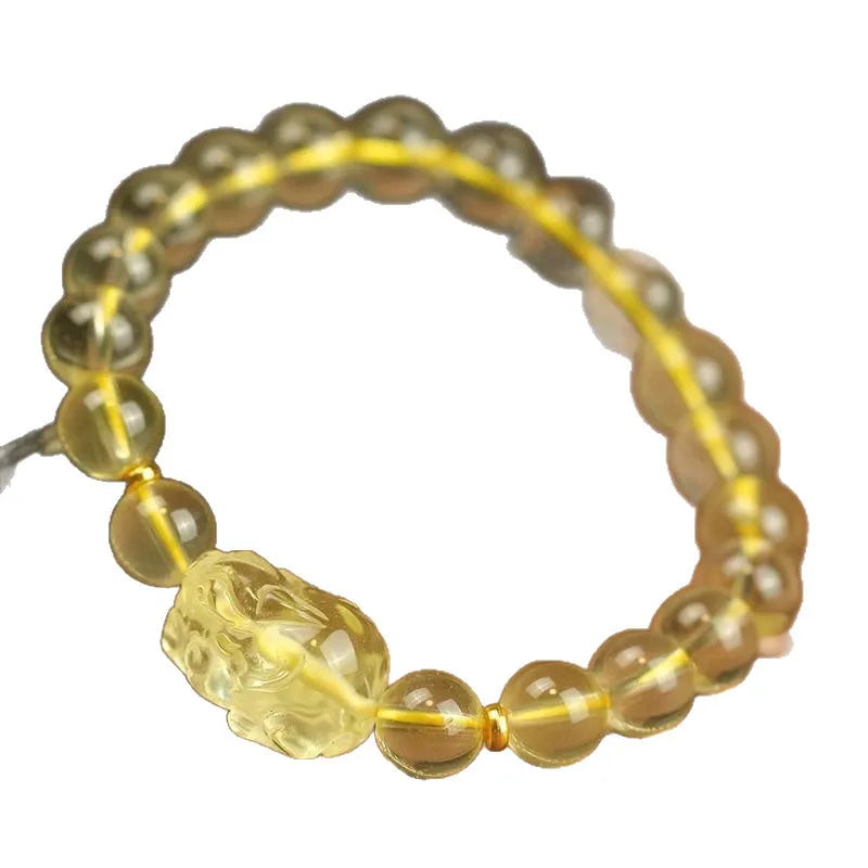 Yellow leather bracelet with a Pi Xiu charm and artificial crystal beads in national style.