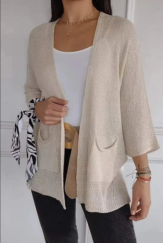 Women's waffle-textured cardigan coat in army green with nine-quarter sleeves and pockets.