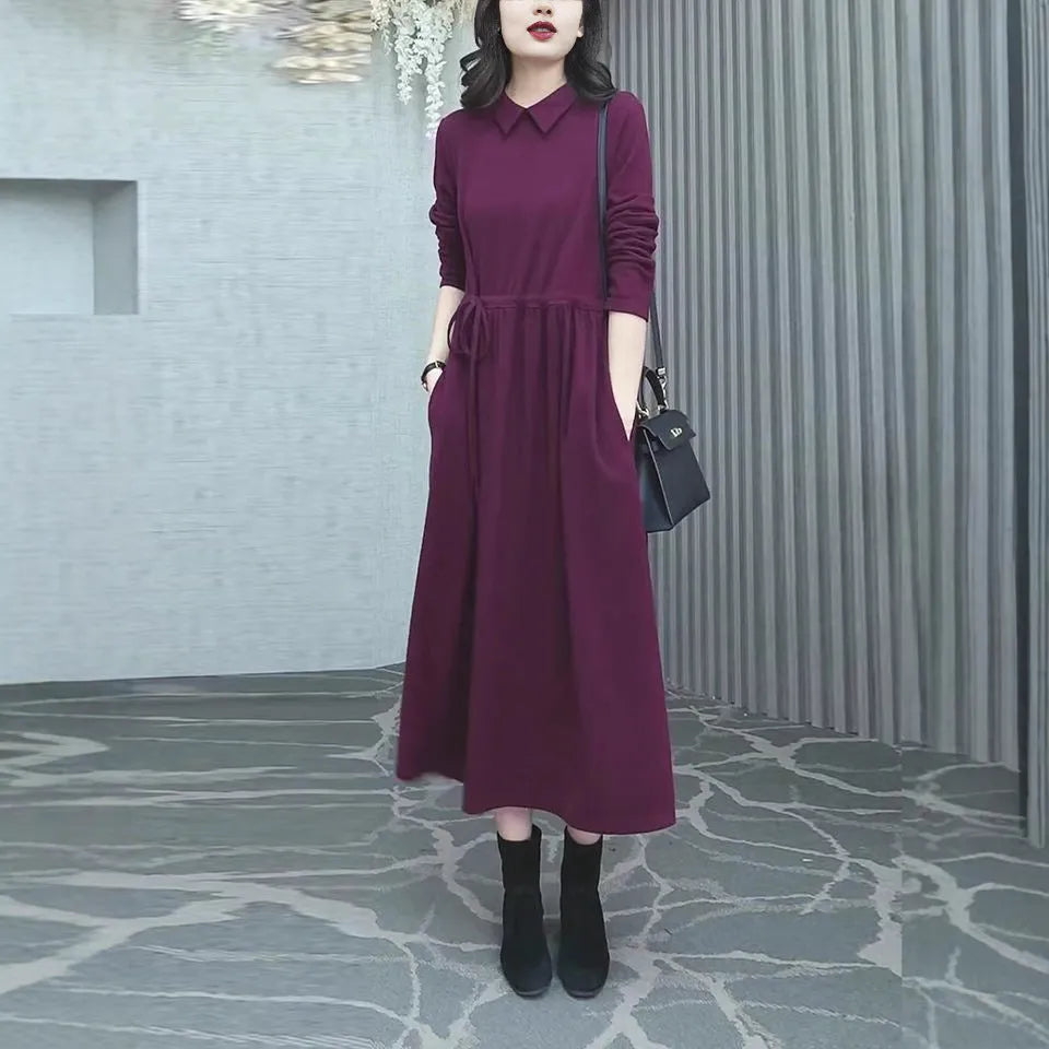 Purplish red plus size women's dress with extra long sleeves and a long skirt for autumn and winter office wear.