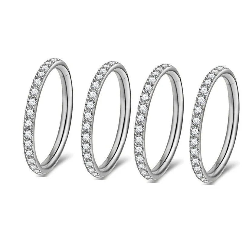 A round, seamless nose ring made of stainless steel, shown in various electroplated colour finishes including gold, rose gold, and black.