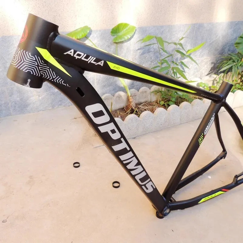 Black green 29-inch aluminium mountain bike frame with internal cable routing ports and disc brake mount.