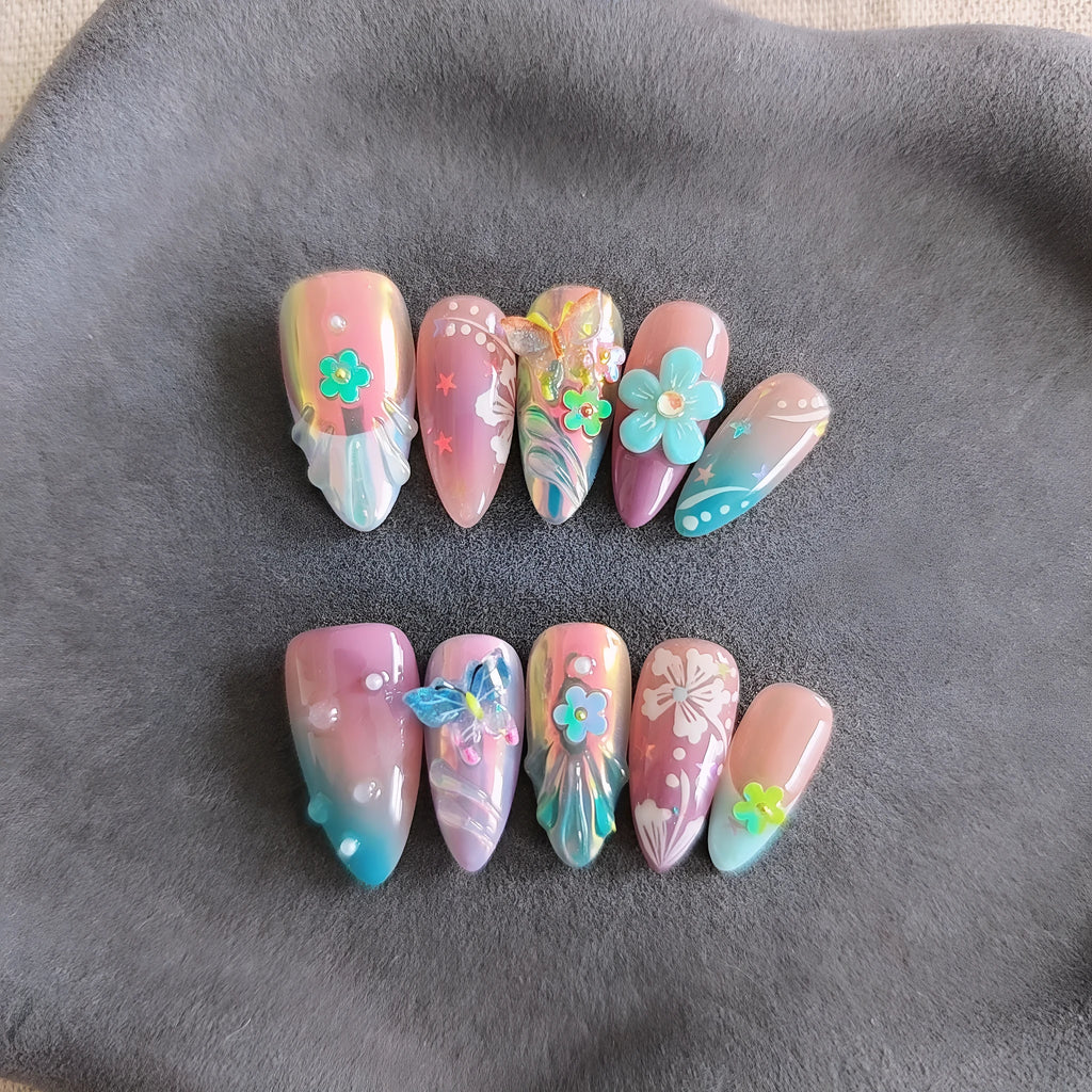 Handmade 3D flower and butterfly nail art sculptures in colourful press-on manicure designs