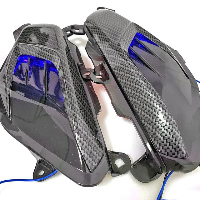 Pair of YAMAHA NMAX side lamps with LED carbon fibre decoration in blue or red light options.