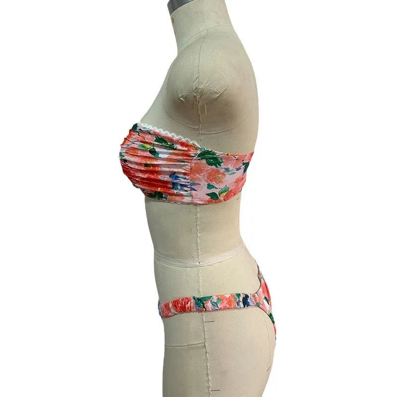 Floral print lace trim bikini top in blue, with matching short, shown on a mannequin.