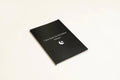 Black hardcover Dream Journal notebook for recording dreams and personal reflections.