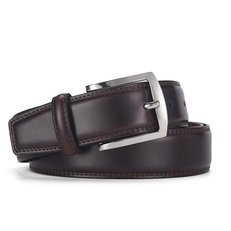Men's black genuine leather belt with a silver alloy pin buckle on a trouser waistband