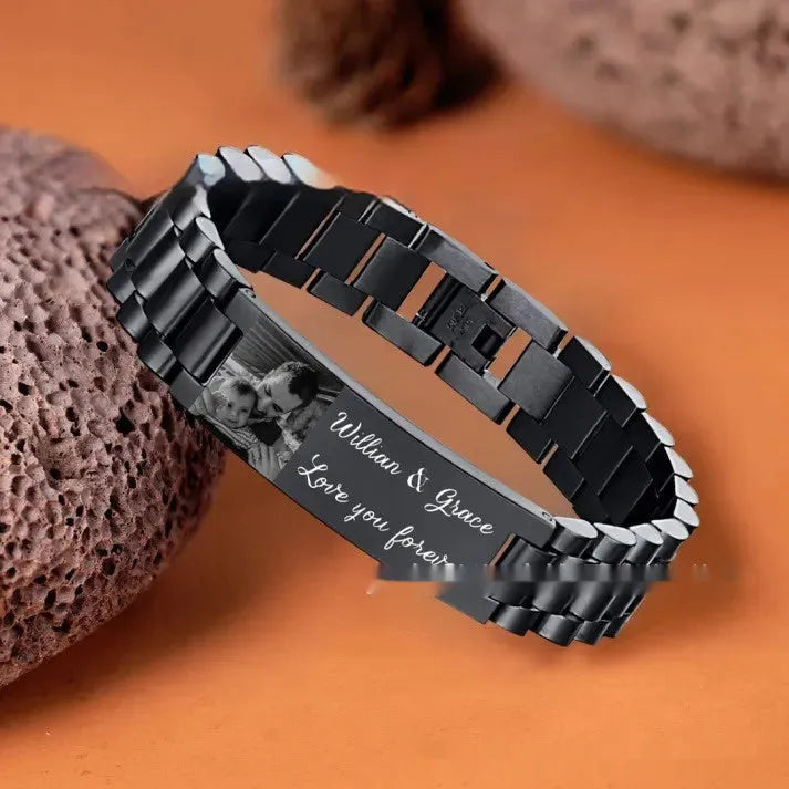 Titanium steel men's bracelet with curved heart shape and engraved lettering in black or grey finish