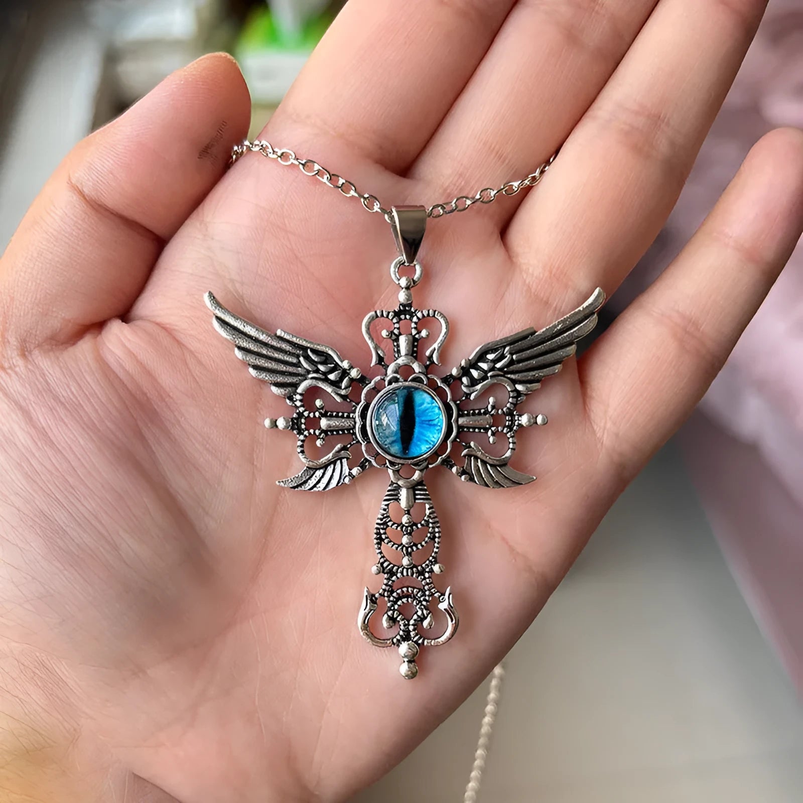 Alloy devil wings cross pendant necklace in geometric shape showing blue colour option