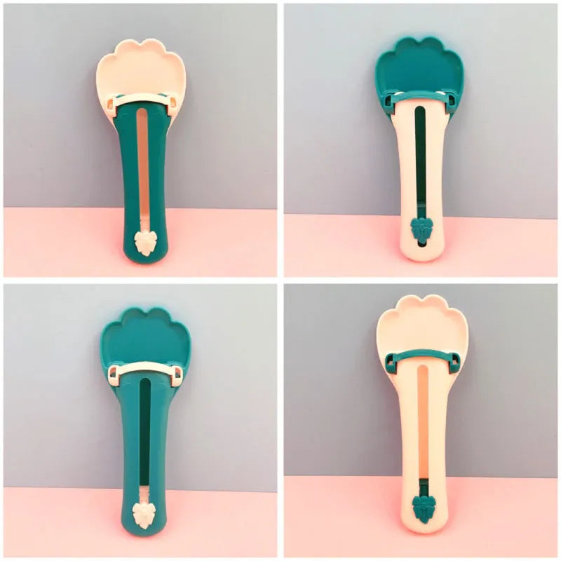 Plastic pet food squeezer dispenser in pink and green colours for feeding cats and puppies.