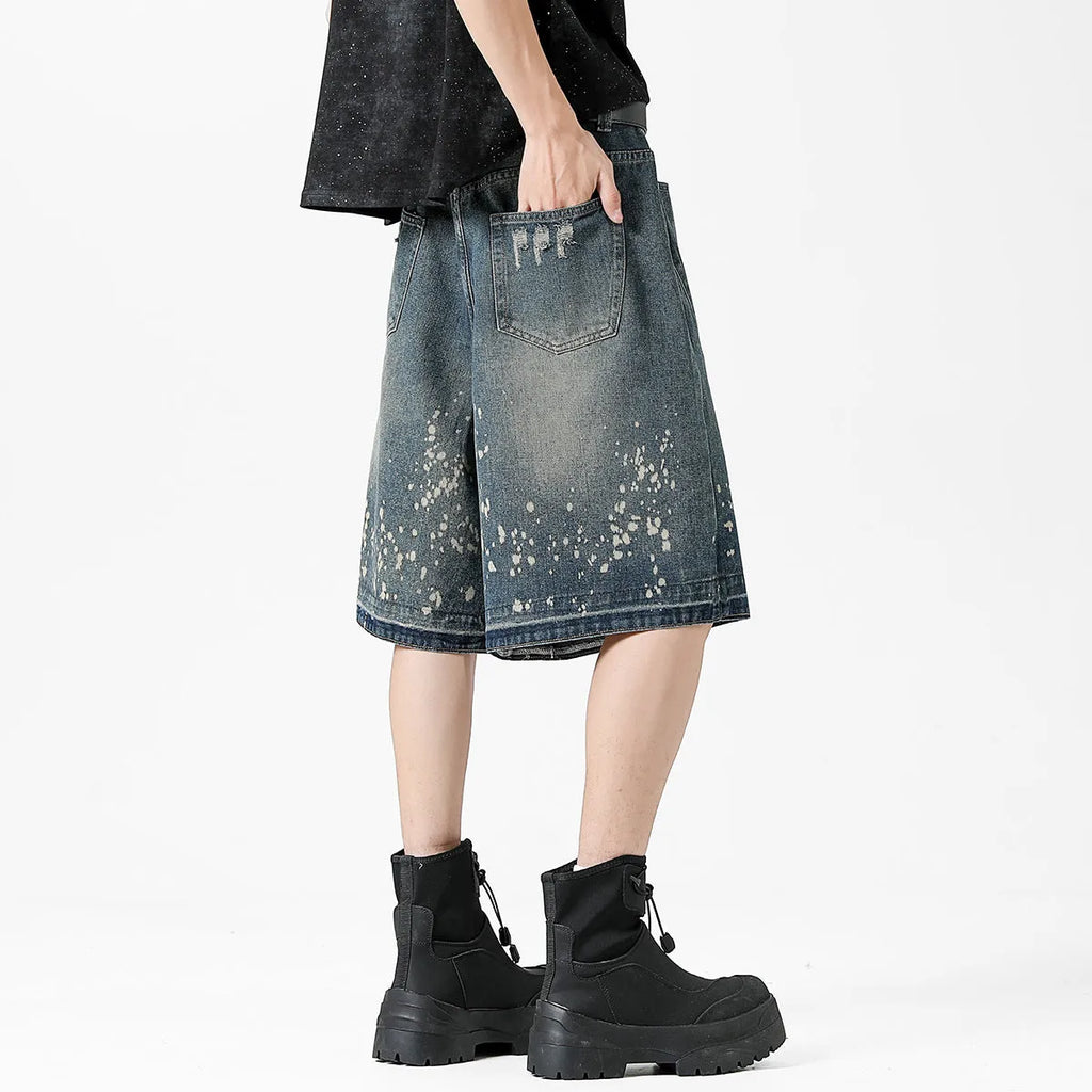 Retro washed denim men's shorts with ripped and splash ink detailing in retro blue colour, straight-leg five-point cut