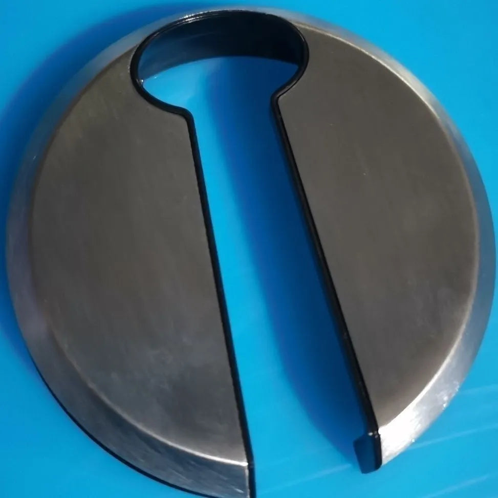 Stainless steel wine bottle opener tool with integrated foil cutter on a kitchen surface.